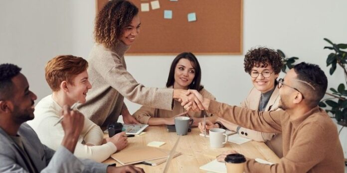 1730301373-1690463617-team-meeting-across-a-desk-1-1